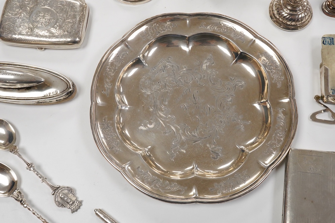 An early Victorian engraved silver plate, of cusped form, by Riley & Storer, London, 1844, with later engraved inscription, 17.5cm, together with two later silver cigarette cases, three silver condiments, a late Victoria